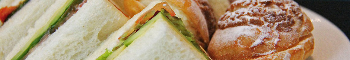 Eating Deli Sandwich at Dibella's Old Fashioned Submarines restaurant in Fairport, NY.